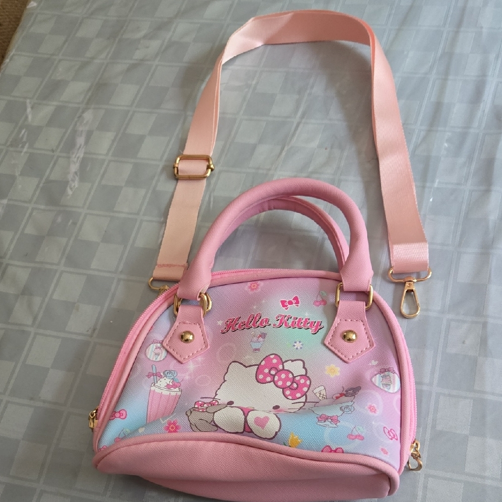 Hello Kitty Girls Pink Mini Bag with Dome Shape and Adjustable Strap.